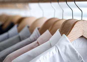 professional clothes hanging up on hangers