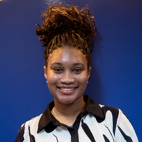 Image of Avianna Howard, wearing a stylish white and black top