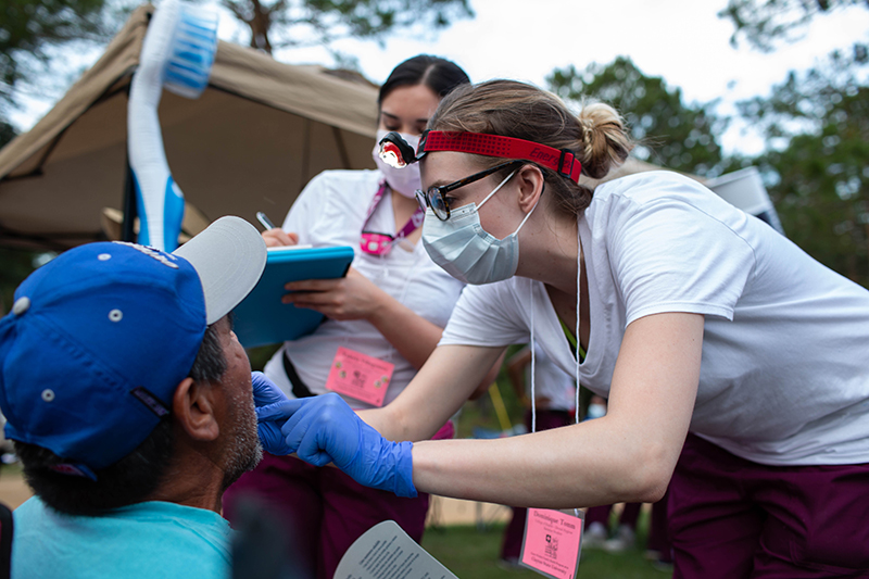 Dr. Joanna Worelds works with student during a checkup