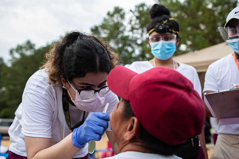 Dental hygiene student gives farmer a checkup