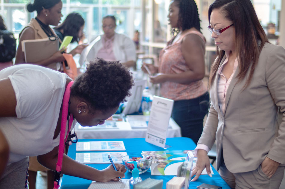 Student signing up at career fair