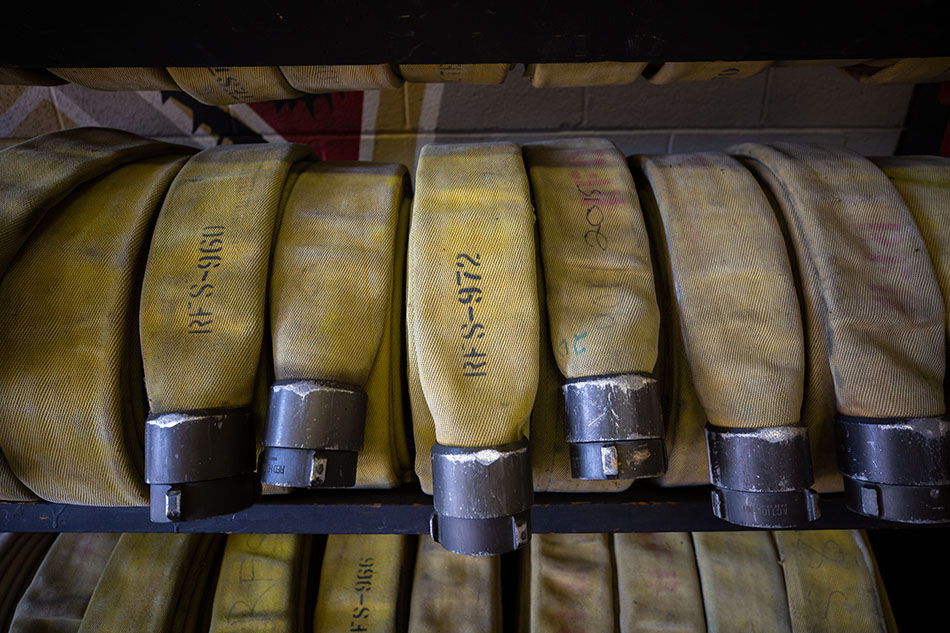 Firehoses stacked at the firehouse.