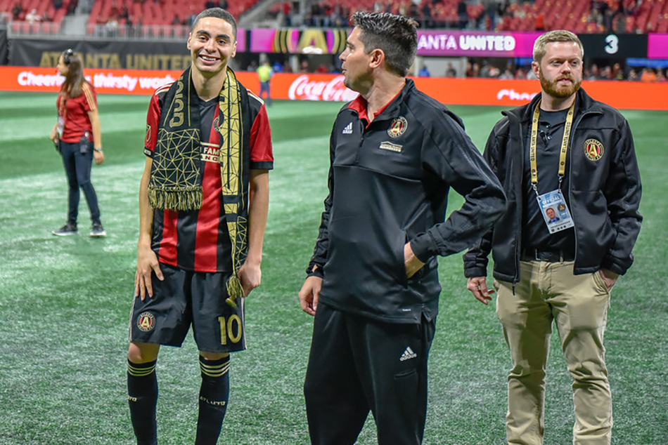 Scott Ashworth performs security at a Atlanta United soccer game.