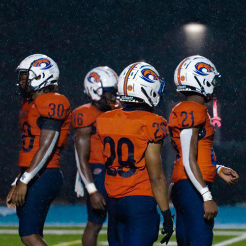 Clayton State Club Football players on the field in the rain