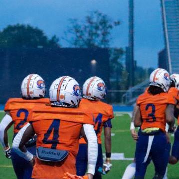 Image of Clayton State Club Football Players running onto the field