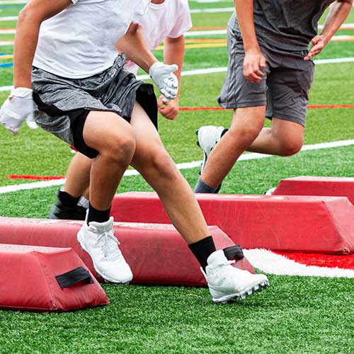 football players running drills