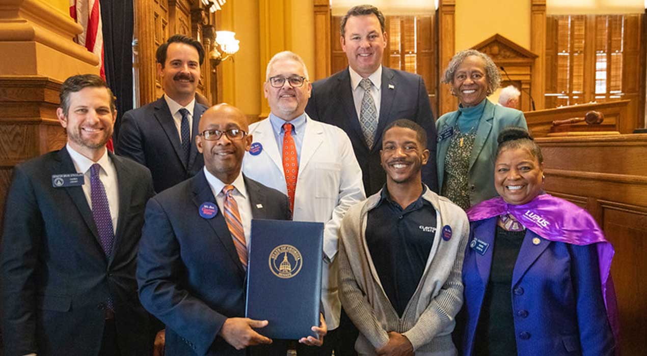 Pres. Georj Lewis, Dr. Dwayne Hooks, and others from Clayton State University pose at the state capitol.