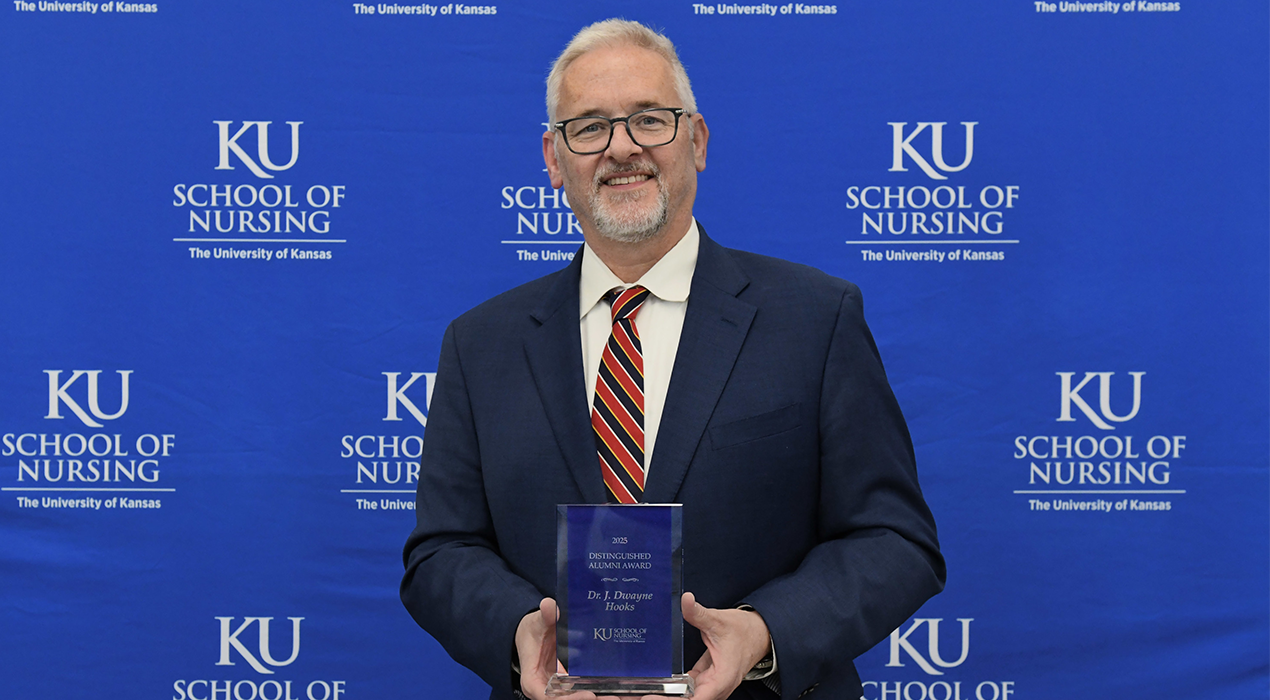 dr_hooks_holding_award