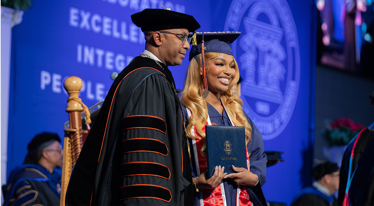 president-lewis-student-at-graduation-ceremony